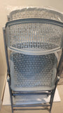 grey folding chairs with slight defect on plastic - The Jerusalem Market